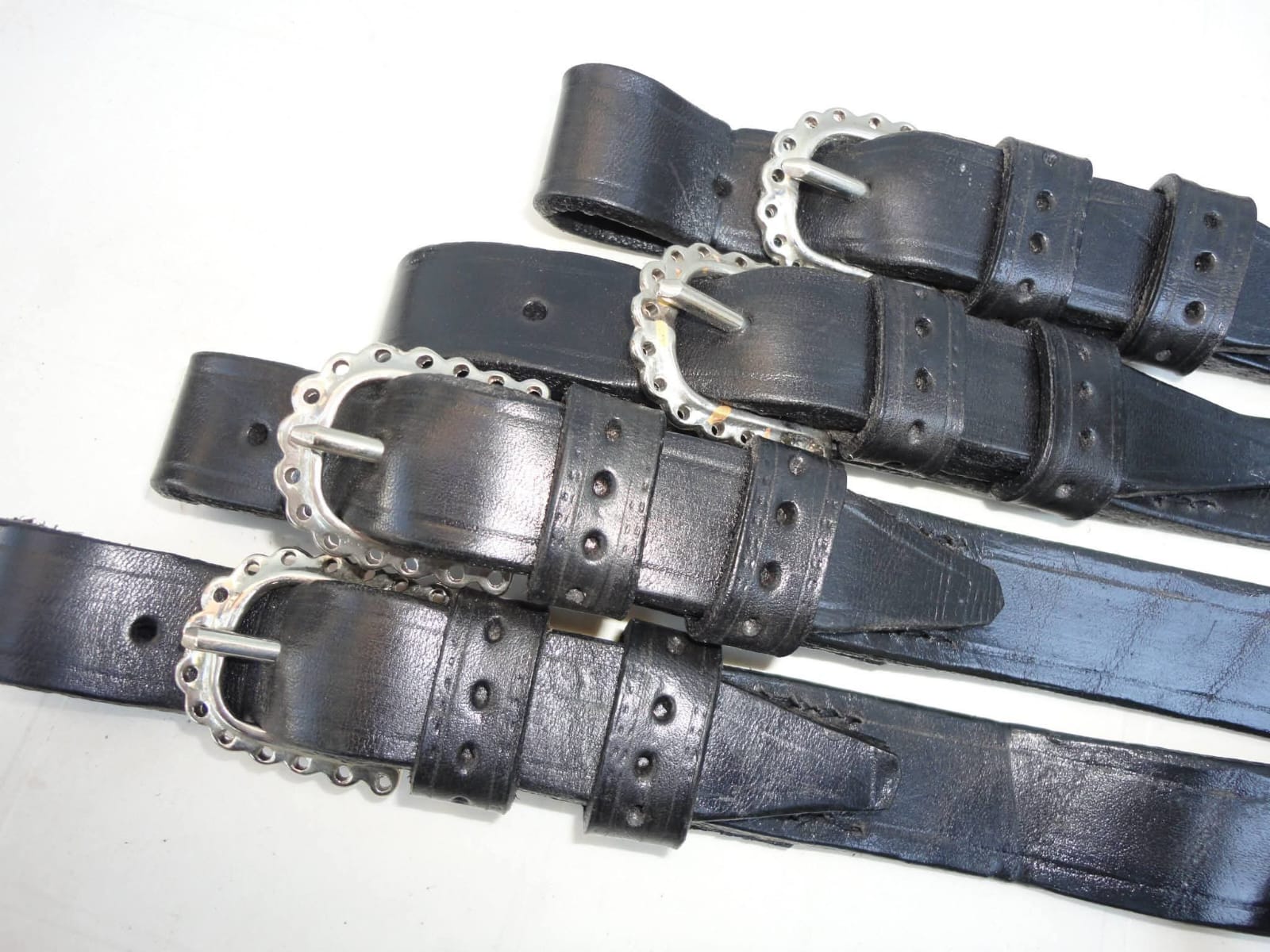 Artisan hand-stitching leather reins
